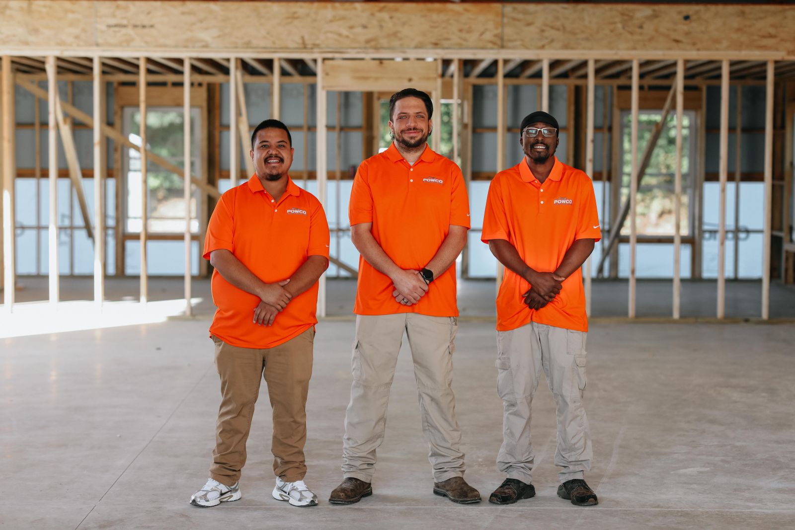 POWCO crew members in front of work truck