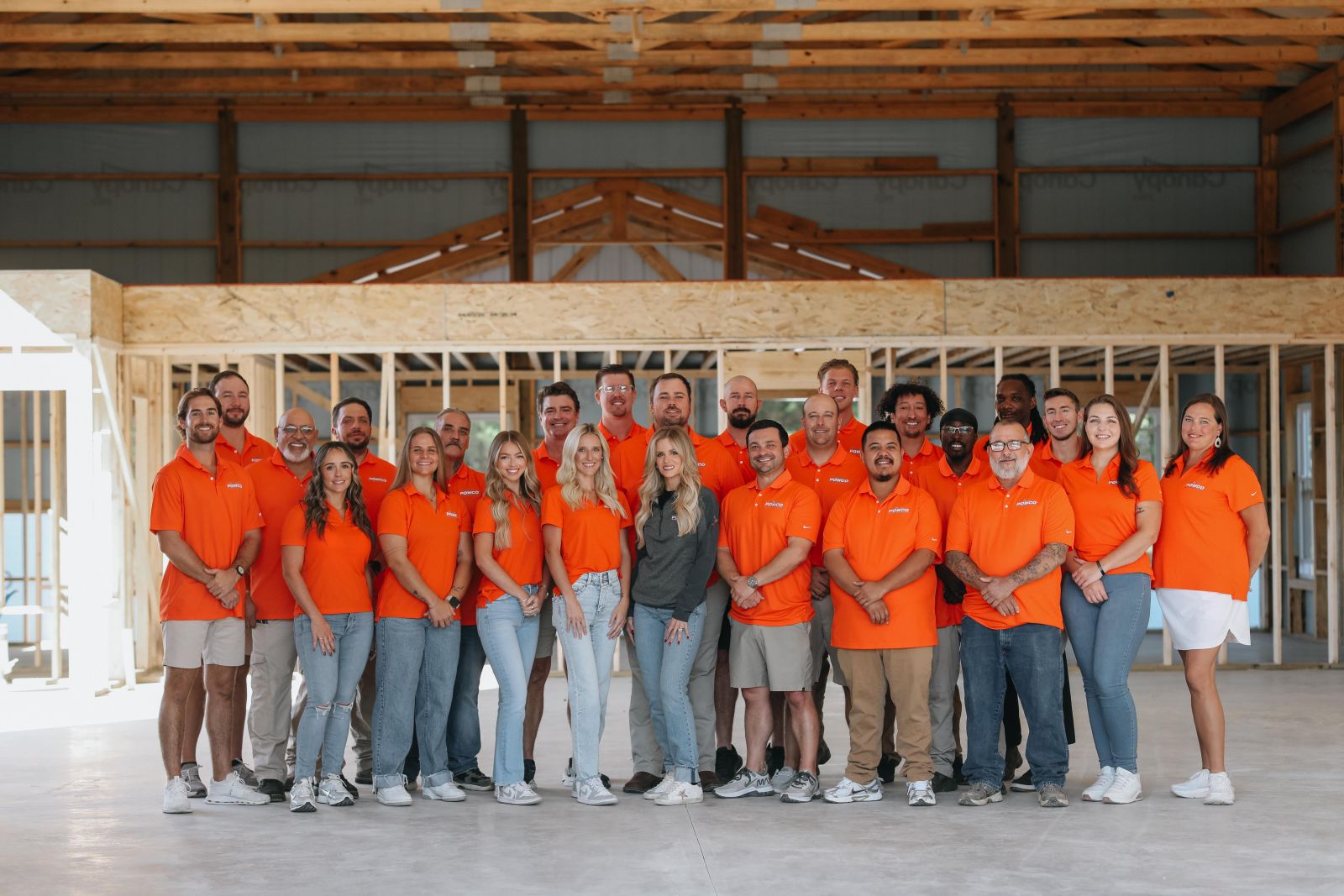 POWCO comapany and staff standing with company truck