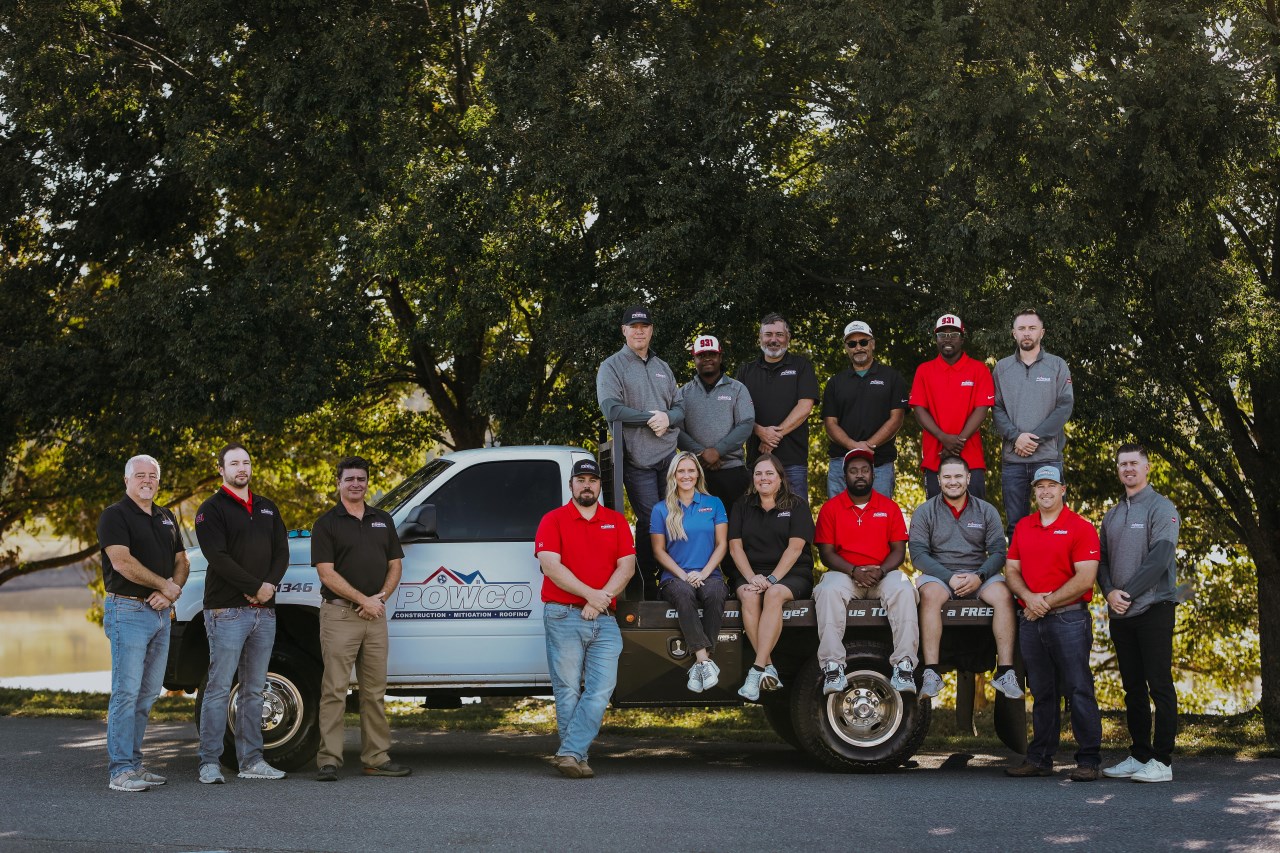 POWCO comapany and staff standing with company truck