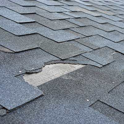 Close up of damaged gray shingles