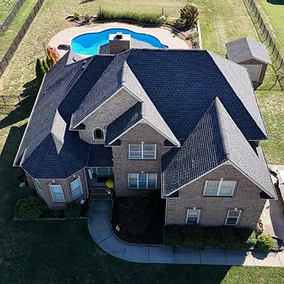Mid-class home with new black shingles