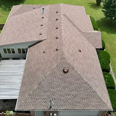Close up of residential roof with new light brown shingles